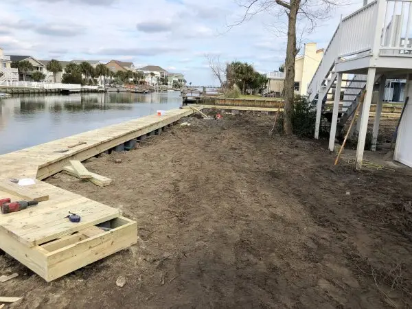 Vinyl Seawall with timber cap in Cherry Grove, SC by Waterbridge Contractors of the Carolinas