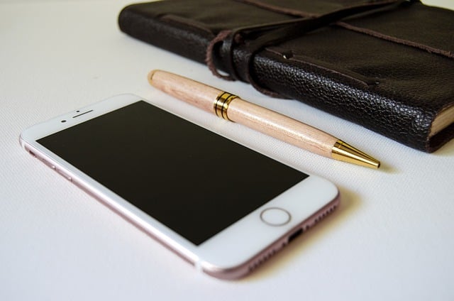 smart phone pen pad of paper in a notebook