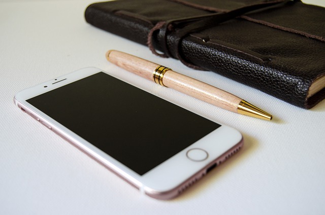 smart phone pen pad of paper in a notebook