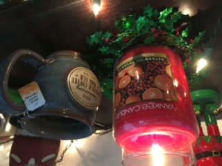 Yankee holiday candle and mug of coffee Norfolk coffee company