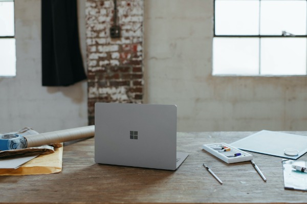 the desk and laptop of an online business owner and blogger