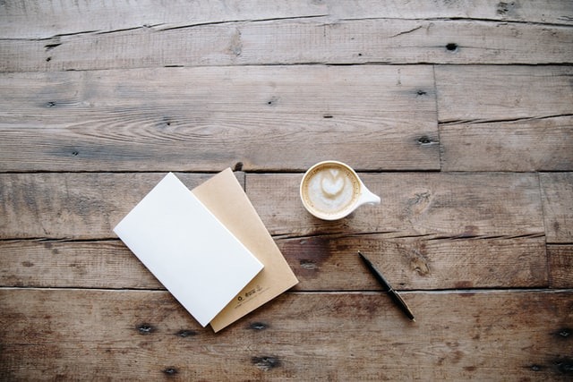 coffee pen and blank paper