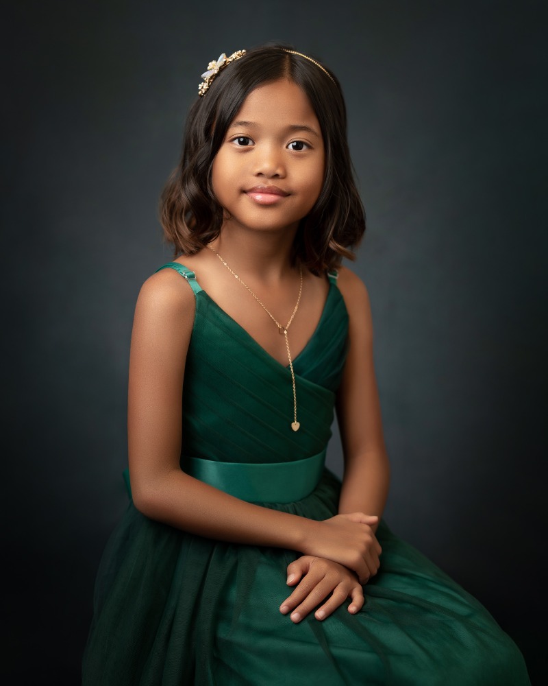 Girl with closed mouth smile