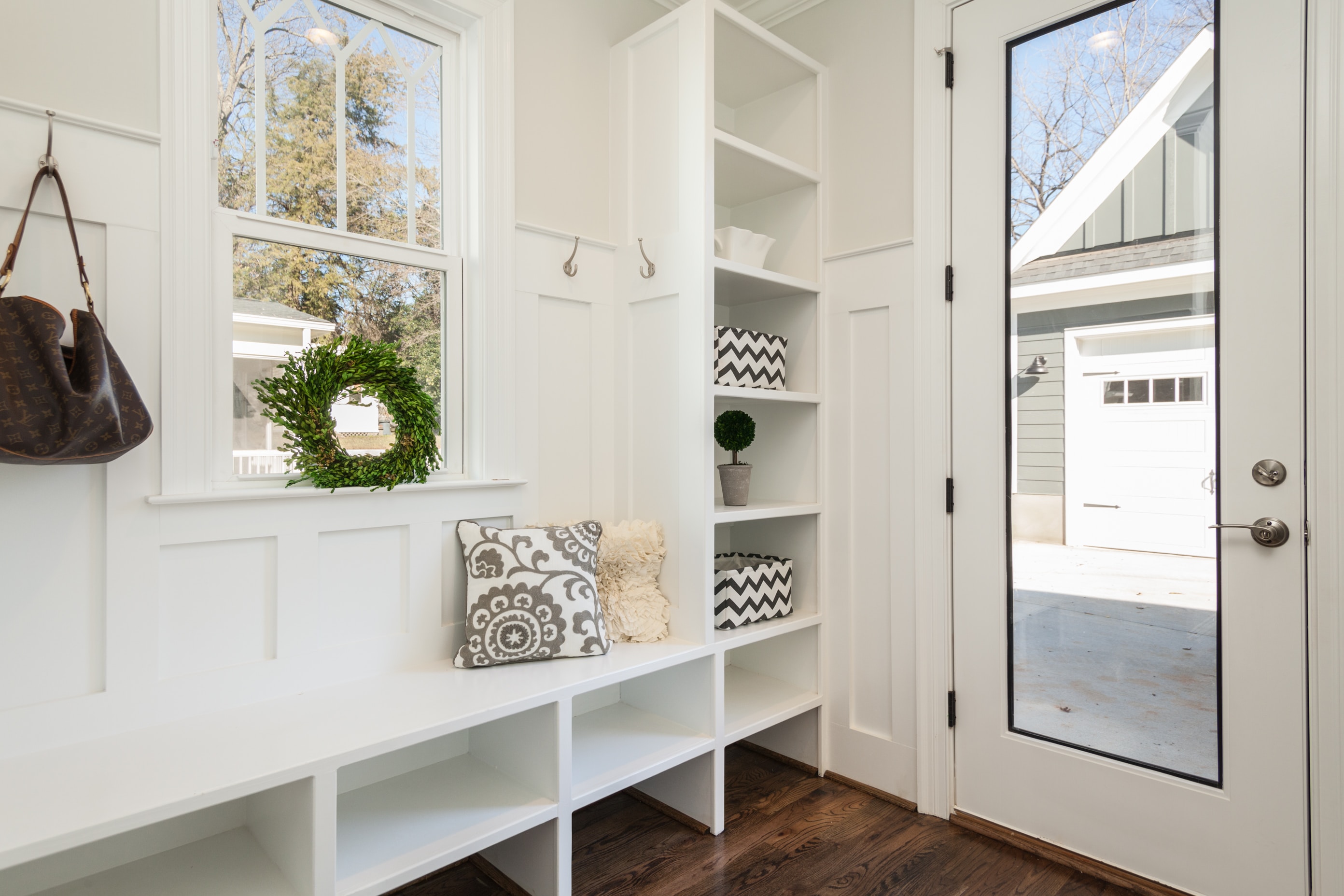 white mudroom with a back door