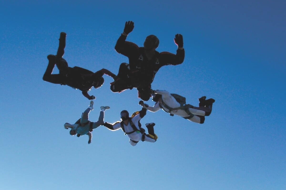 Team of elite skydivers in formation