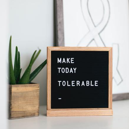 sign and reminder to make today tolerable. 