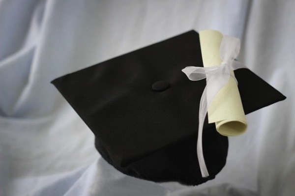 Graduation cap and diploma. Learn how to launch a business from home, create content, and become successful.