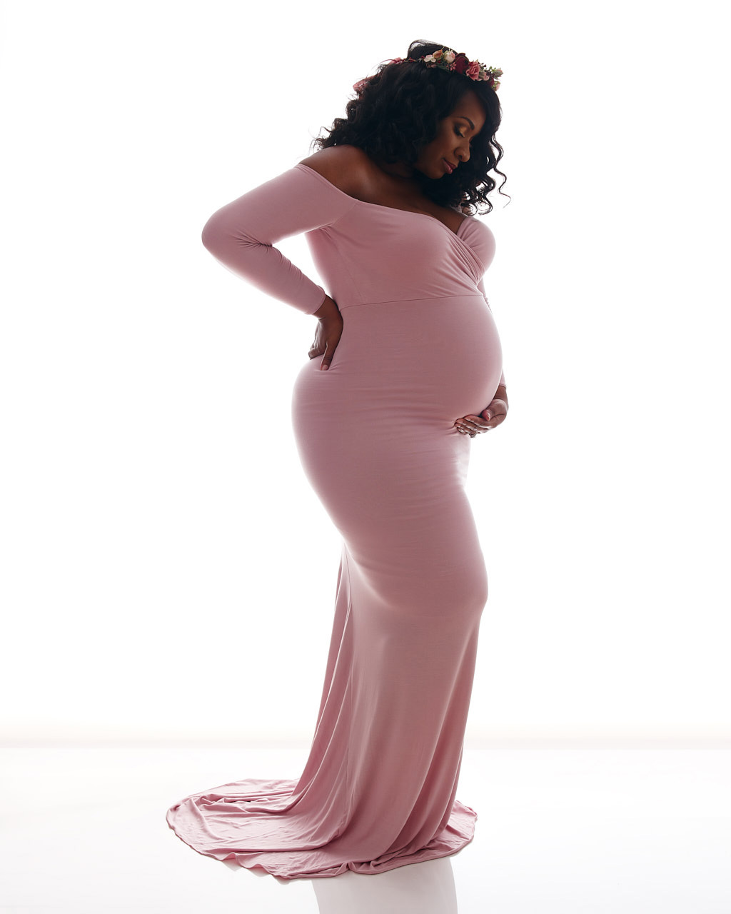 Pregnant woman of maternity portrait silhoutte in pink snug gown. Maternity portrait photographer near Washington DC  Portraits by Jared Wolfe in Alexandria VA