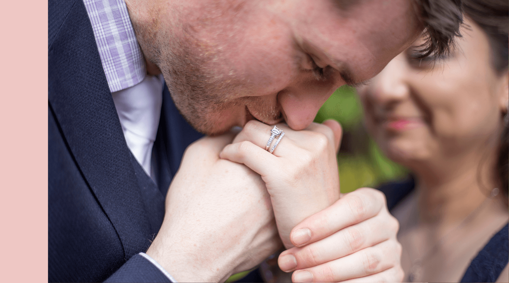 man kissing hand with engagement ring