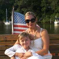 Suzanne, founder of Maisonette de Madness, with her son by the water
