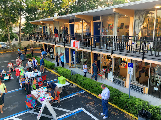 People gathering to admire and purchase art at Faith Arts Village Orlando.